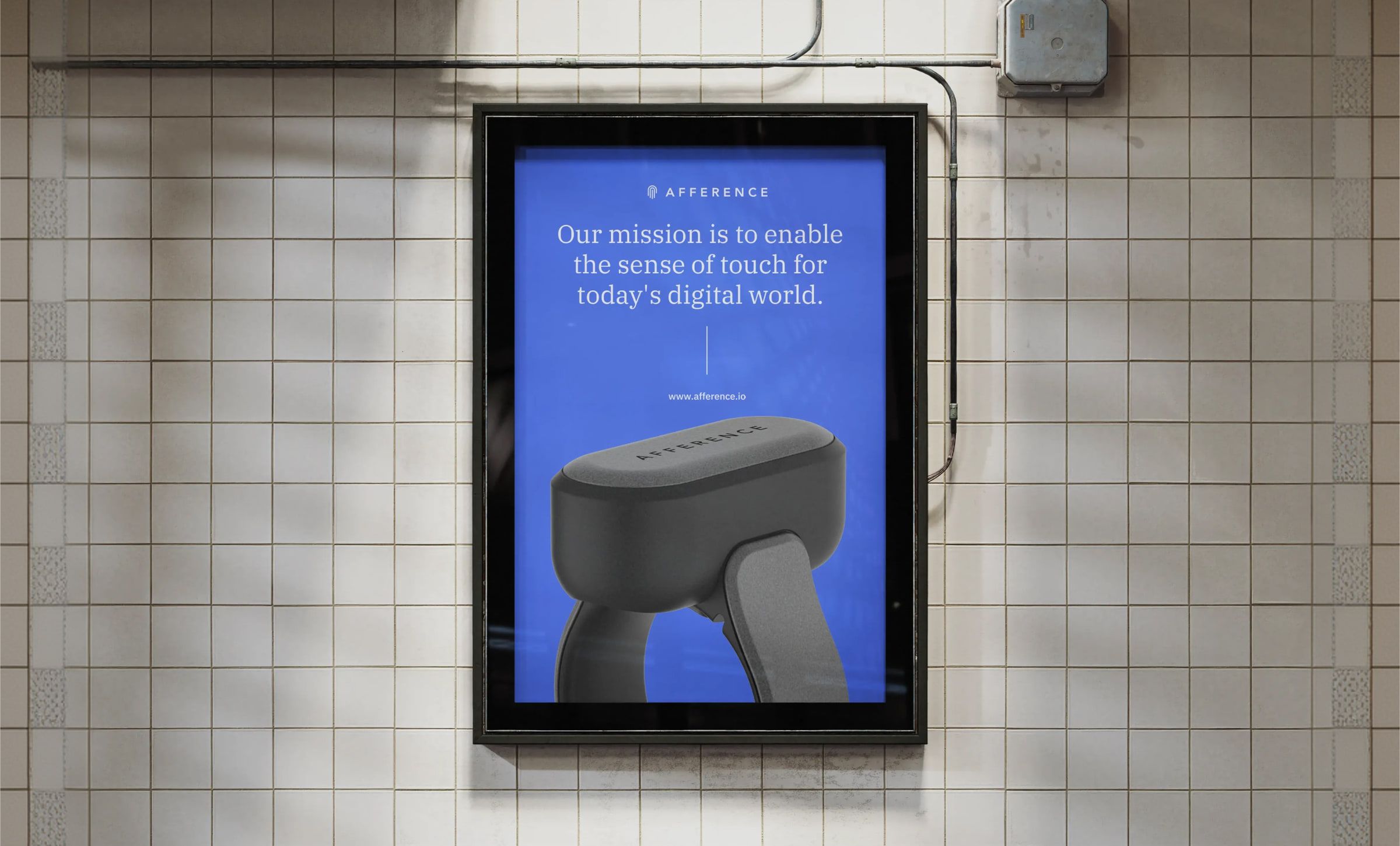 Afference poster in a subway station: “Our mission is to enable the sense of touch for today’s digital world.”