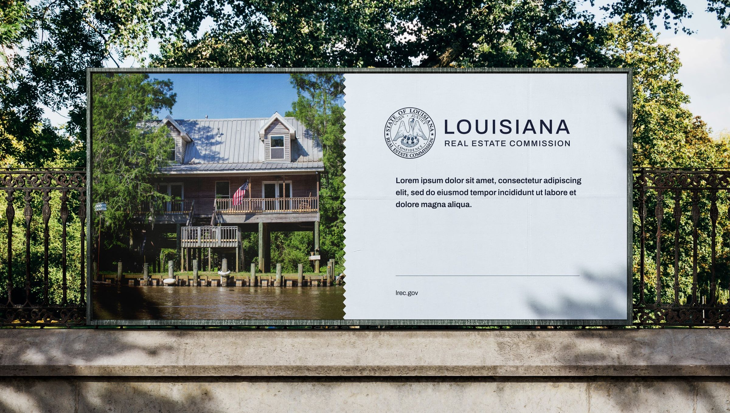 Louisiana Real Estate Commission billboard by a bayou home